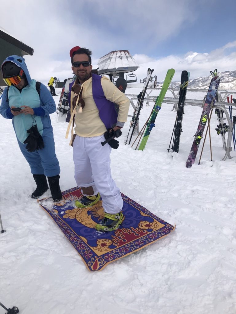 Aladdin costume on snowboard