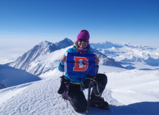 Sharing the Chair: 7 Summits Climber Kim Hess Kim Hess atop Mt Vinson