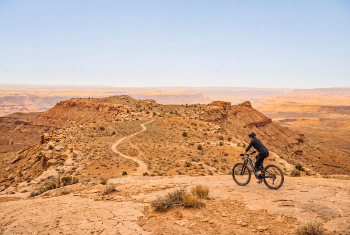 Female eMTB Rider Exploring Desert Trail